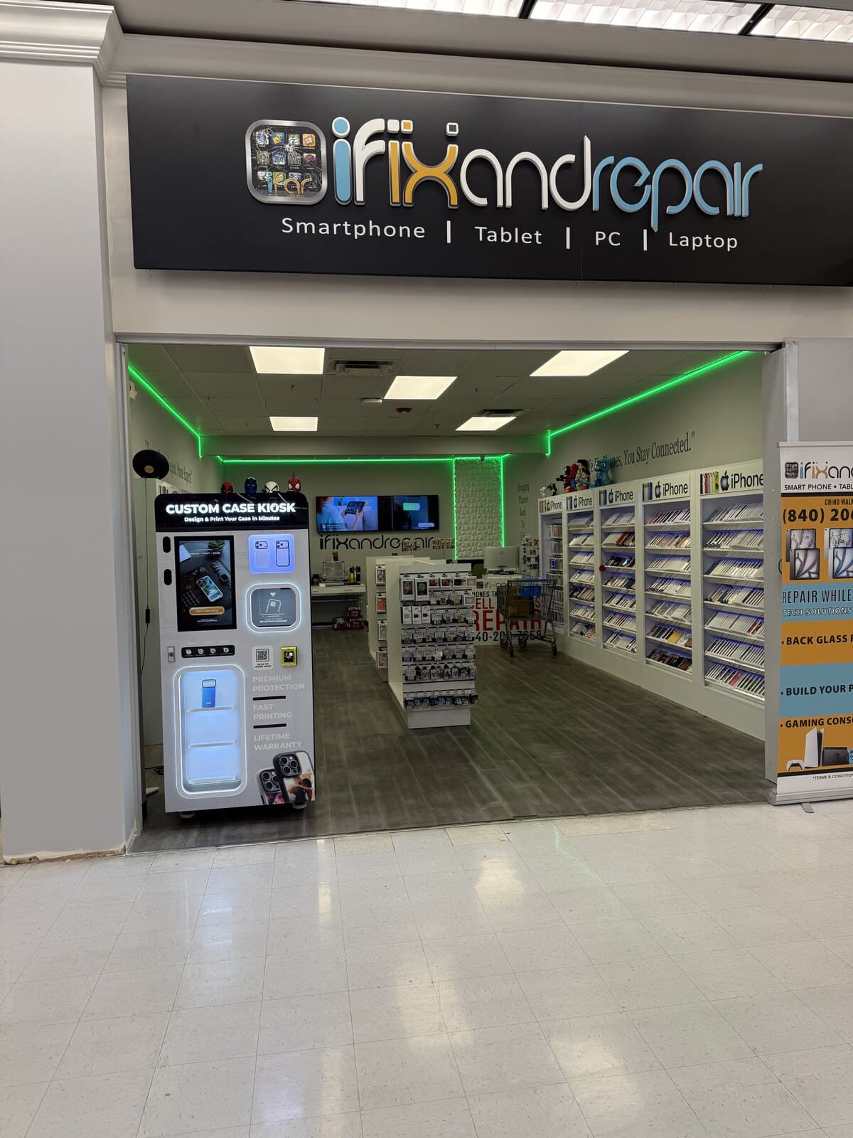 The iFix and Repair storefront inside the Chino Walmart Supercenter, with the Custom Case Kiosk standing just inside the entrance