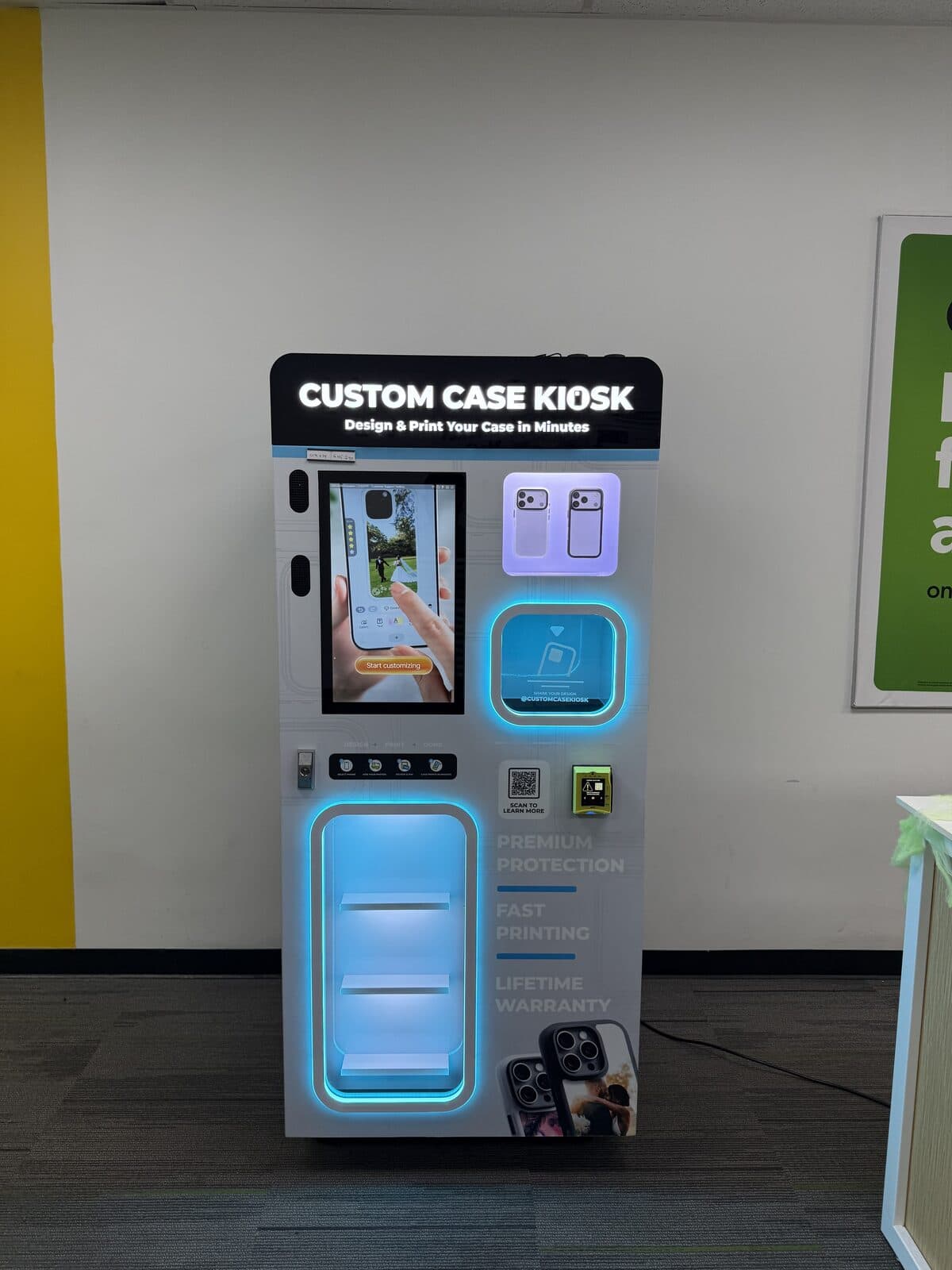 Custom Case Kiosk inside Cricket Wireless on Harrisburg Blvd in Houston, TX — front view with the design touchscreen, the case selector and the backlit pickup shelves