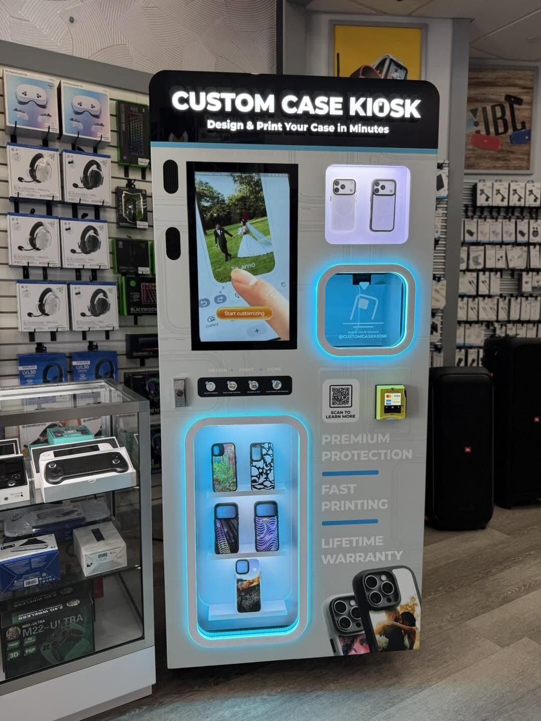Custom Case Kiosk inside Magic Cellular at Plaza Isabela in Isabela, Puerto Rico — lit case shelves and design touchscreen beside the accessory wall