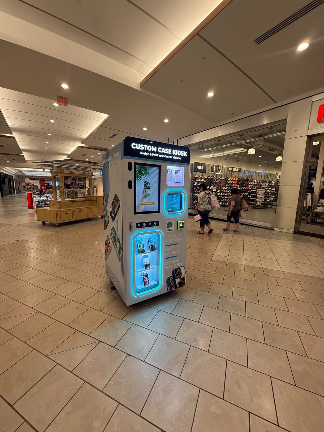 Custom Case Kiosk at Dartmouth Mall in North Dartmouth, MA — three-quarter view of the kiosk on the mall concourse